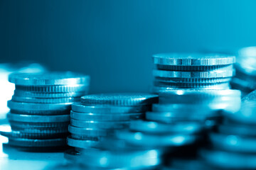 Wall Mural - rows of coins and blurred bokeh for finance and banking concept