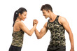 © krishna - Two sportive people in sportswear showing their biceps, isolated on white background