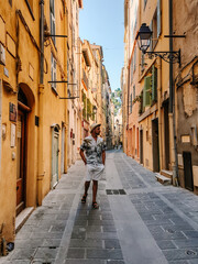 Wall Mural - Menton France colorful town French Rivera, colorful old town Menton on french Riviera, France. Europe, young guy visit Menton during vacation