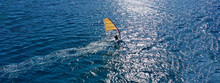 Aerial Drone Ultra Wide Photo Of Professional Wind Surfer Practice In Deep Blue Open Ocean Sea