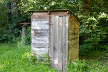 Old Rustic Wooden Outhouse In The Country . High Quality Photo