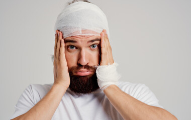 man with bandaged head health problems trauma discontent hospitalization