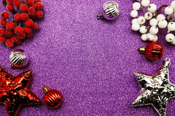 Wall Mural - Red Christmas balls decoration ornaments with space copy on purple glitter background