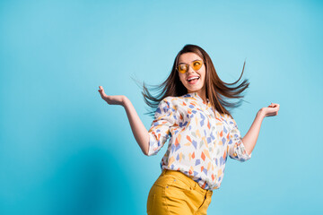 Sticker - Photo portrait of brunette dancing at party with blowing in air hair enjoying weekend isolated on bright blue color background