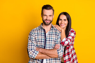 Sticker - Portrait of attractive cheerful cute couple folded arms trust idyllic isolated over bright yellow color background