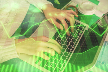 Fototapete - Double exposure of woman hands typing on computer and forex chart hologram drawing. Stock market invest concept.