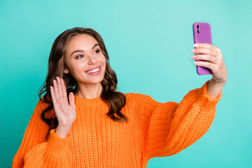 Canvas Print - Photo of young cheerful girl happy smile wave hello make selfie recording video isolated over turquoise color background