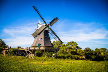 Wall Mural - Historical windmill in Ascheberg at the Great Ploen lake in Schleswig-Holstein, Germany