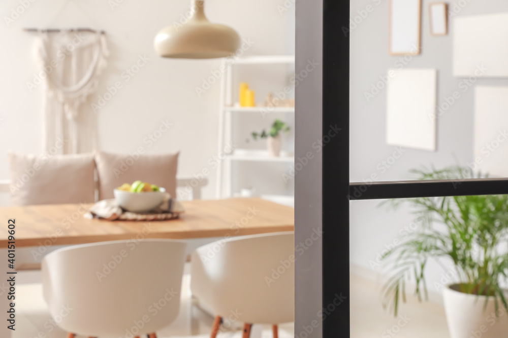 Stylish interior of modern dining room, blurred view