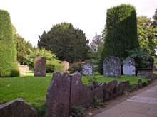 Stone Tombstones In An Ancient Cemetery In England, Great Britain