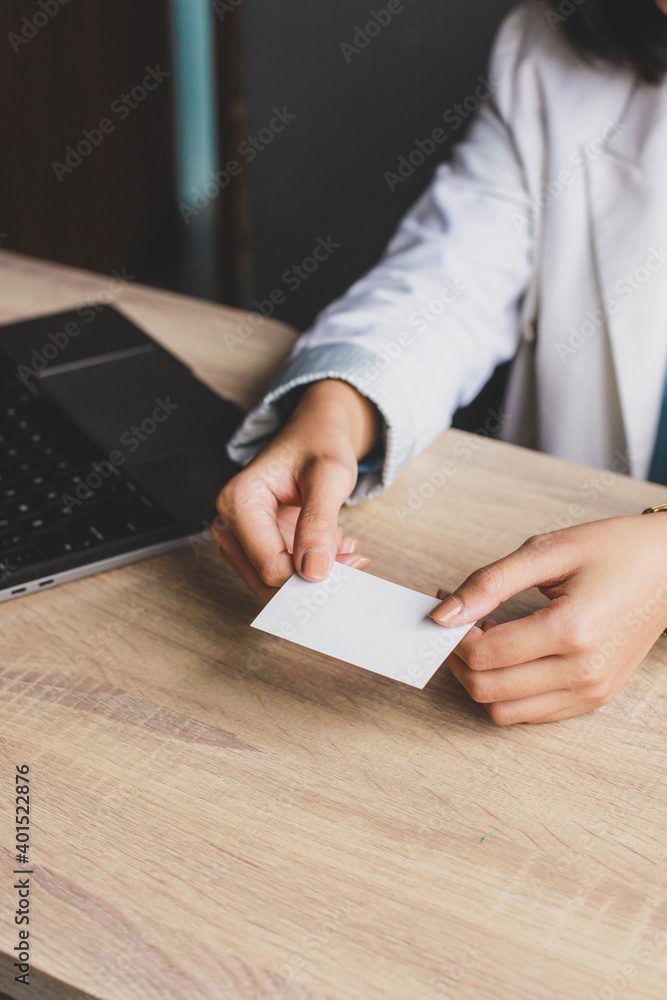 Business woman holding and giving white business card or blank card ...