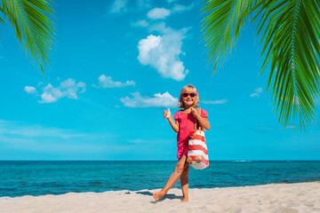 Wall Mural - happy cute girl with big bag on beach vacation