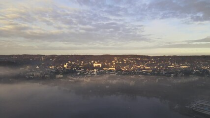 Sticker - View of Starnberg near Munich during a foggy winter morning. The drone gives aerial view of the small tourist town on the lake.