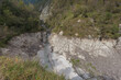 Top view of gorge with torrent in a very wild area, Dolomiti Bellunesi National Park, Italy. The gorge is periodically flooded by the waters of Lake Mis