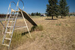 Cokeville, Wyoming - Swingset and playground at an old abandoned seedy motel, with overgrown weeds in the parking lot