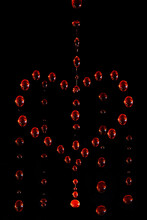 Symbol Of A Crying Heart Made Of Red Water Drops On A Dark Background, Motion Blur