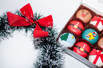 Christmas-themed cupcakes in trays to give a special gift to a happy Christmas season on white background.