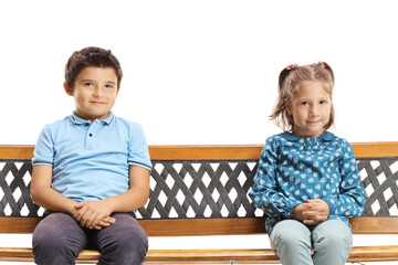 Poster - Cute boy and a shy girl sitting on a bench and looking at the camera