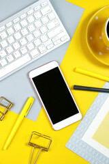 Wall Mural - 2021 colors of the year, yellow and gray, desktop workspace with keyboard, smart phone and desk accessories. Top view blog hero header creative composition flat lay. Close up.