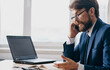 © SHOTPRIME STUDIO - businessman in a suit mobile phone at the table in the office emotions model communication