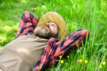 Rest in countryside. Eco environment. Summer rest. United with motherland. Nature is my home. Farmer bearded man rest after day work. Farmer relax on green grass. Ecology concept. Summer vacation