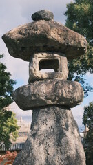 Wall Mural - ancient stone lantern structure in the park