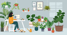 Woman Working On Laptop At Home Decorated With Indoor Plants