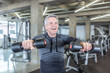 © weyo - Male in his 60s enjoys dumbell workout in the fitness center