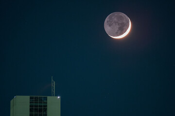 Wall Mural - moon over city