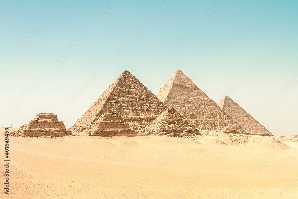 The pyramids of Giza, Cairo, Egypt. Oldest of the Seven Wonders of the Ancient World, and the only one to remain largely intact. - obrazy, fototapety, plakaty 