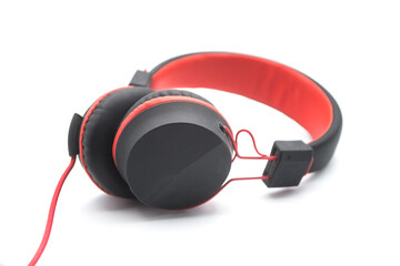 Closeup of black and red headphones on white background