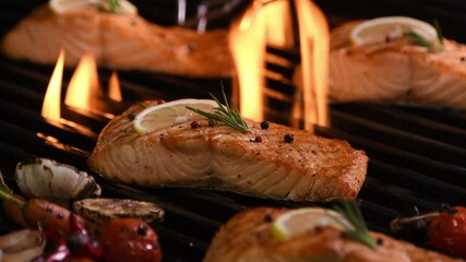 Wall Mural - Grilled salmon fish with various vegetables on the flaming grill