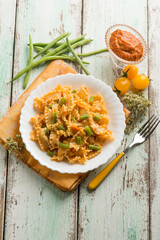 Canvas Print - pasta with dried tomatoes pesto and green peas