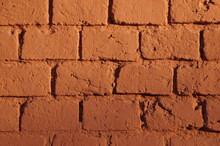 Fragment Of A Brick Wall Painted With Red Paint