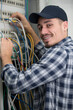 © auremar - male technician connecting cables to server