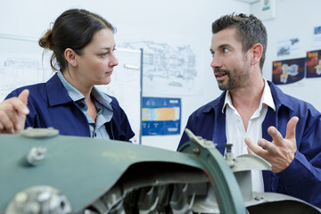 two modern aircraft engineers man and woman in discussion