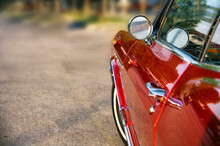 A Selective Focus Shot Of A Red Vintage Car