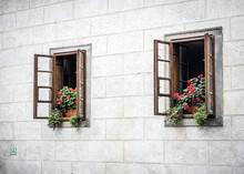 Wooden Windows With Flowers In The Old Sandstone House
