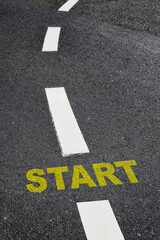 Start written on black asphalt road and white marking lines, Business challenge and road to success idea