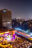 Fototapeta Las - Aerial view of the city of Cairo at night along the river Nile. Skyline of the African city of Egypt