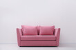 © New Africa - Comfortable pink sofa near white wall indoors, space for text. Simple interior