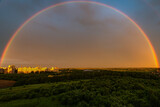 Fototapeta Tęcza - Double rainbow in the morning on horisont above the area and ields