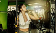 © splitov27 - Tired young fit woman drink water in the gym