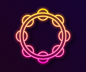 Glowing neon line Musical instrument percussion tambourine, with metal plates icon isolated on black background. Vector.