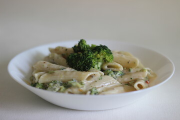 Wall Mural - Penne pasta in white sauce with cheese and broccoli