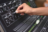 Fototapeta  -  Sound engineer hand adjusting sound test adjust level on audio mixing