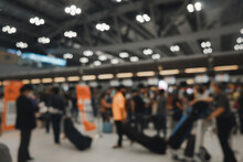 Blur Background Of Airport Check-In Counters With Passengers