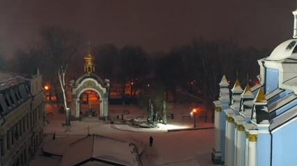 Wall Mural - View of St. Michael's Cathedral at Christmas with winter blizzard and bell ringing, Kyiv, Ukraine