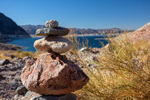 Rock Cairn At Lake Mead, Nevada - Stones Stacked On Top Of Each Other Acting As Natural Marker And Guide For Hikers