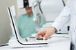 © pressmaster - Hand of young female ophthalmologist turning knob on examination equipment